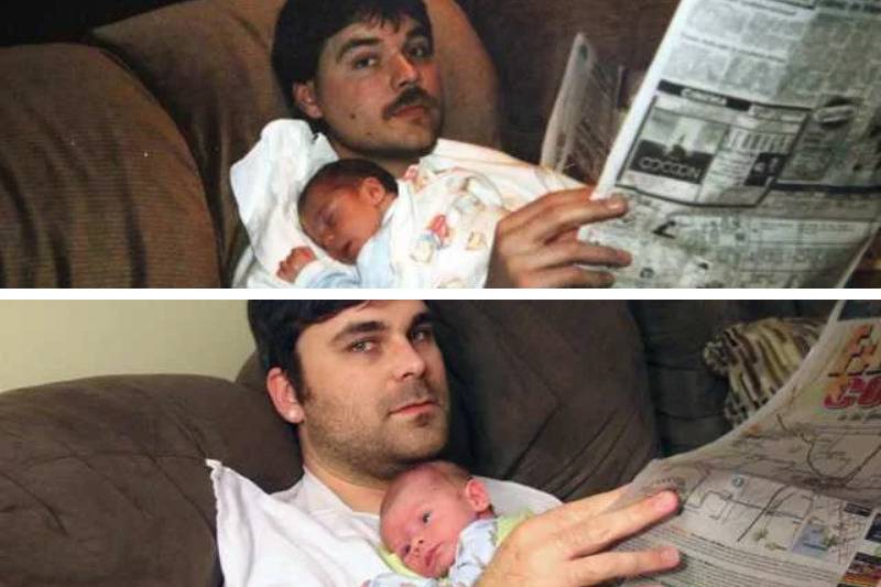 old and new dad holding baby while reading the newspaper