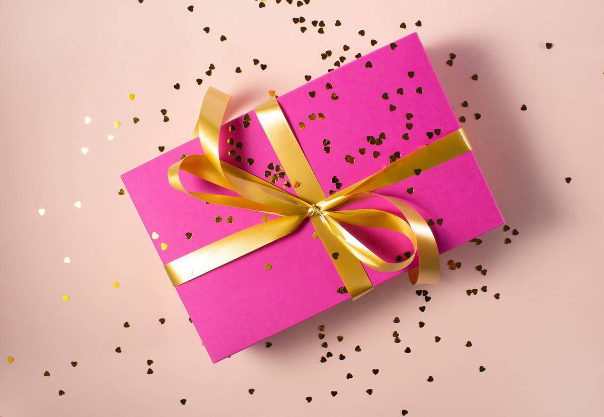 pink gift with gold ribbon
