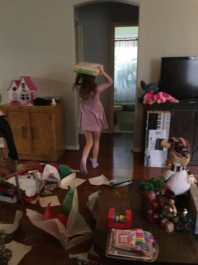 little girl happy about receiving printer paper for christmas