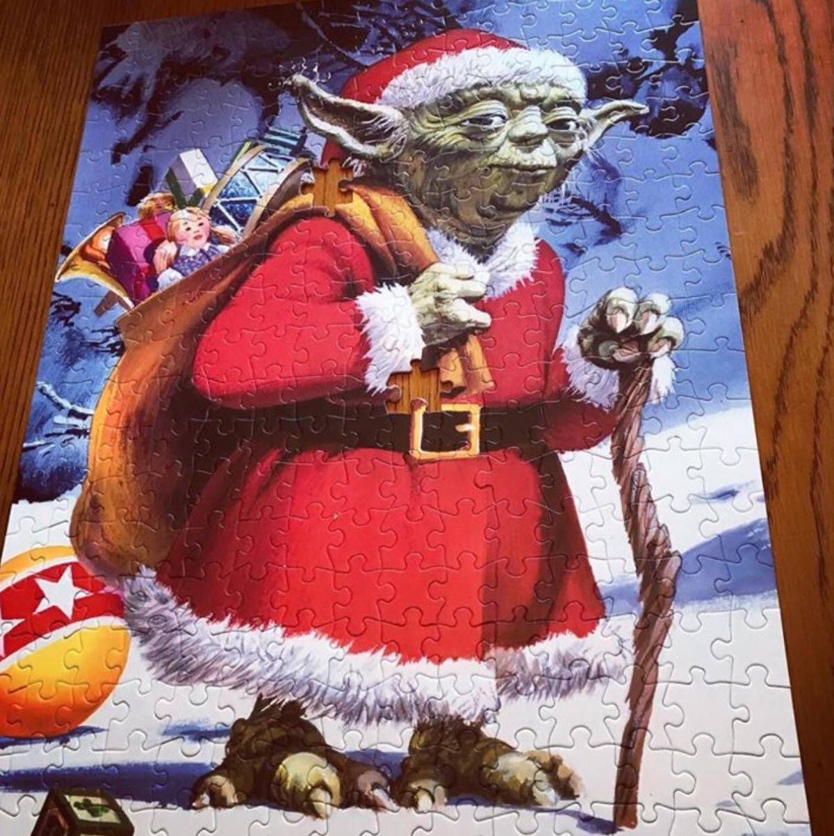 puzzle image is yoda dressed as santa