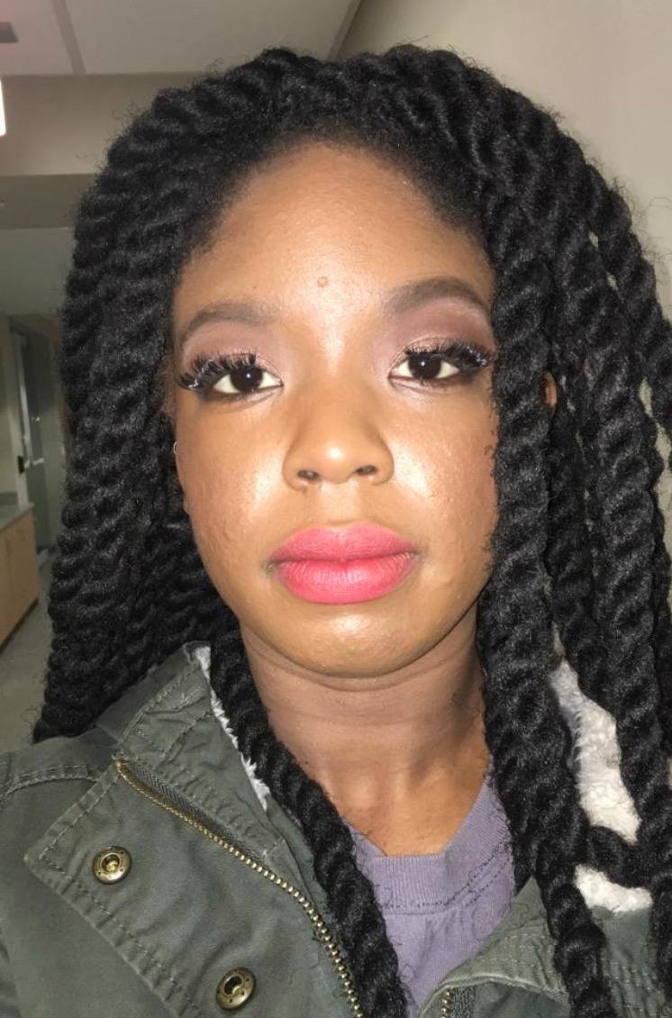 woman's makeup and false eyelashes are horribly applied 