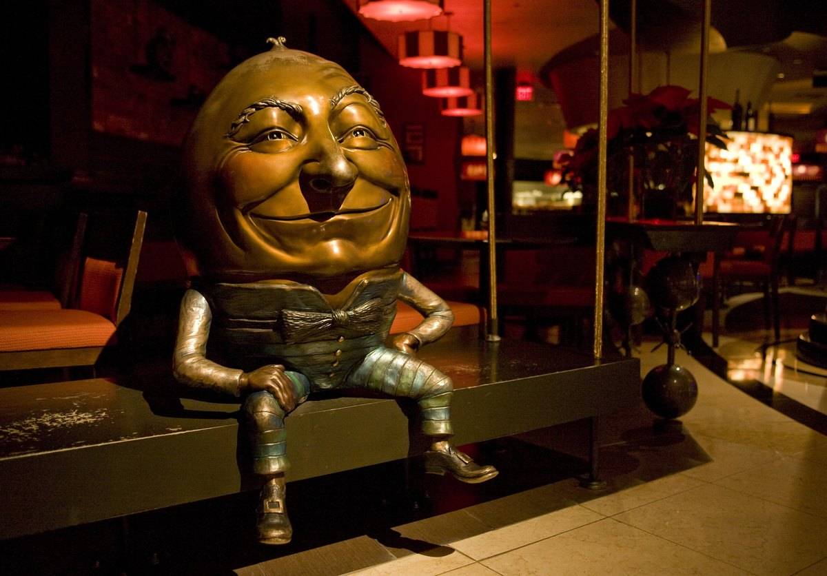 LAS VEGAS, NV - 2010: A metal sculpture of Humpty Dumpty sitting on a bench at David Burke Restaurant in the Venetian Hotel and Casino is seen in this 2009 Las Vegas, Nevada, photo.