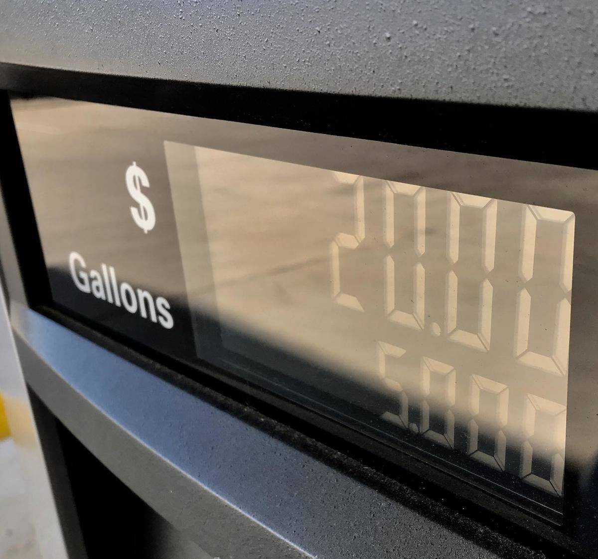 Gas pump meter reading exactly $20 for exactly 5 gallons