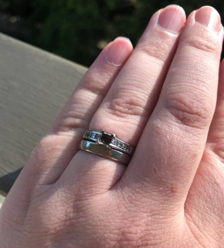 engagement ring on finger with diamond missing