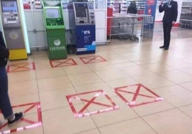 squares of tape on ground very close together