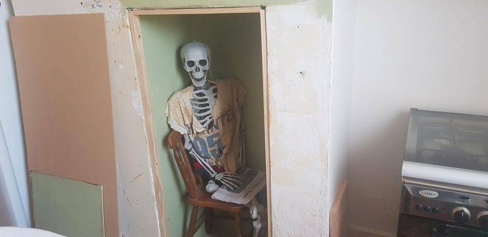 skeleton in wall