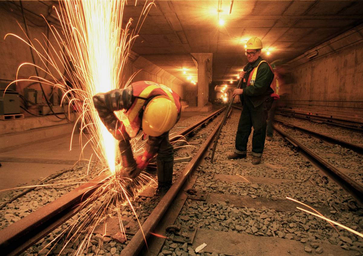 man welding in toronto on yonge station 