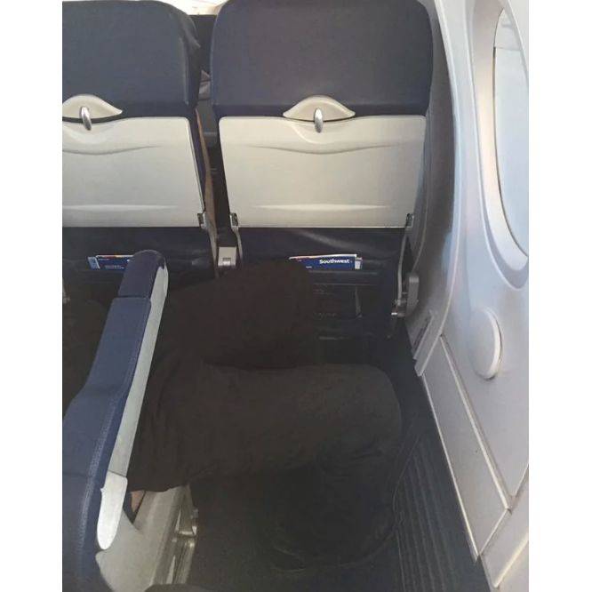 person sitting sideways on a plane