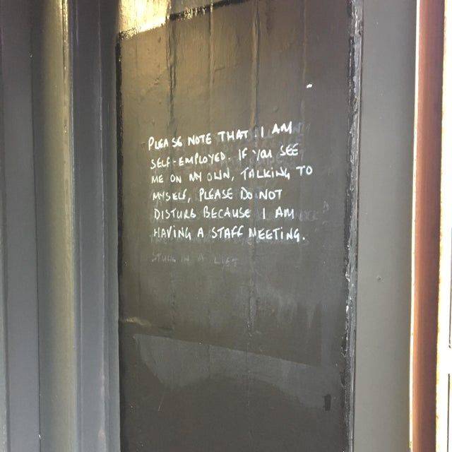 white writing on black wall