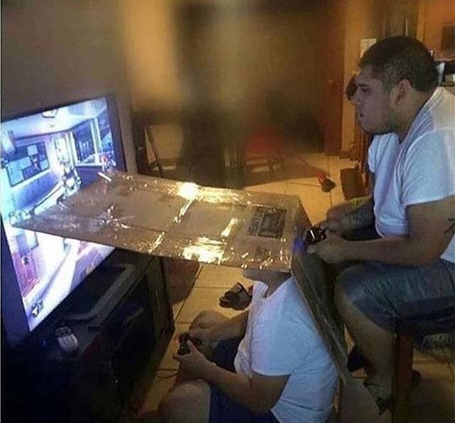 cardboard attached to tv for split screen effect 