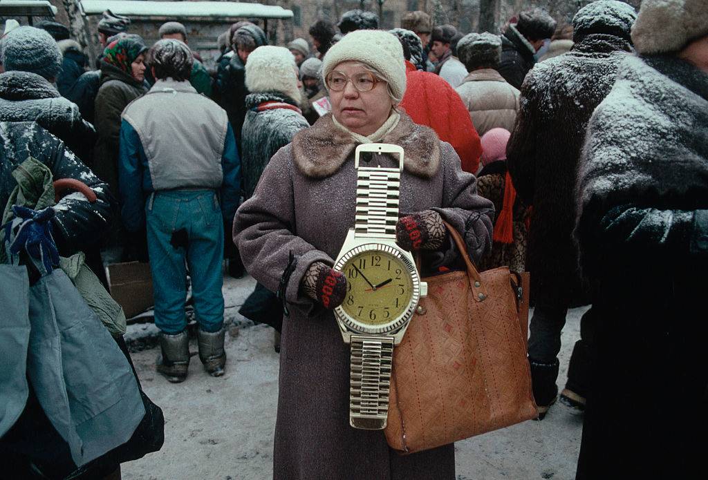 Woman holding clock 