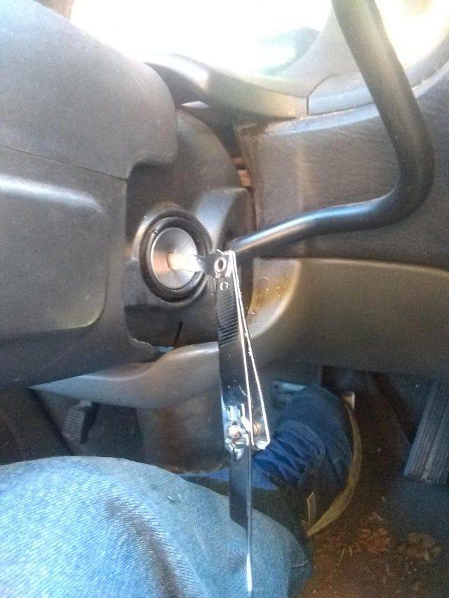 person using nail clippers to start car ignition