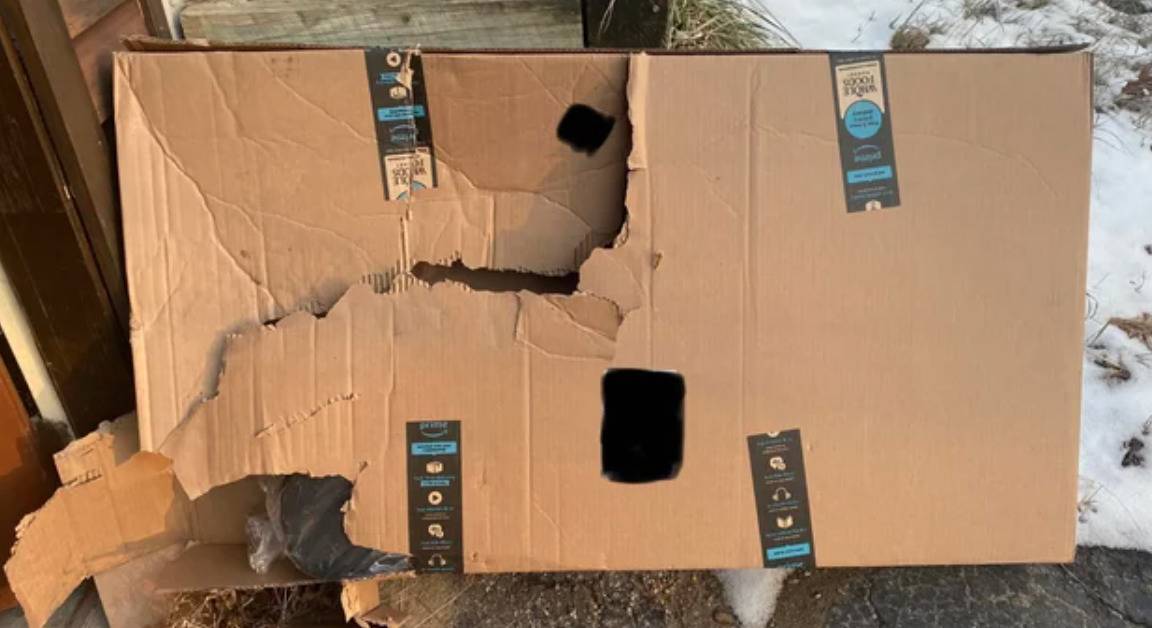 amazon box on porch is ripped up and broken