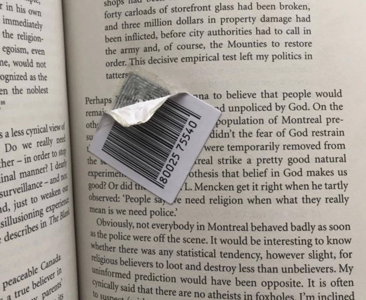 barcode sticker in the middle of a paragraph inside a book