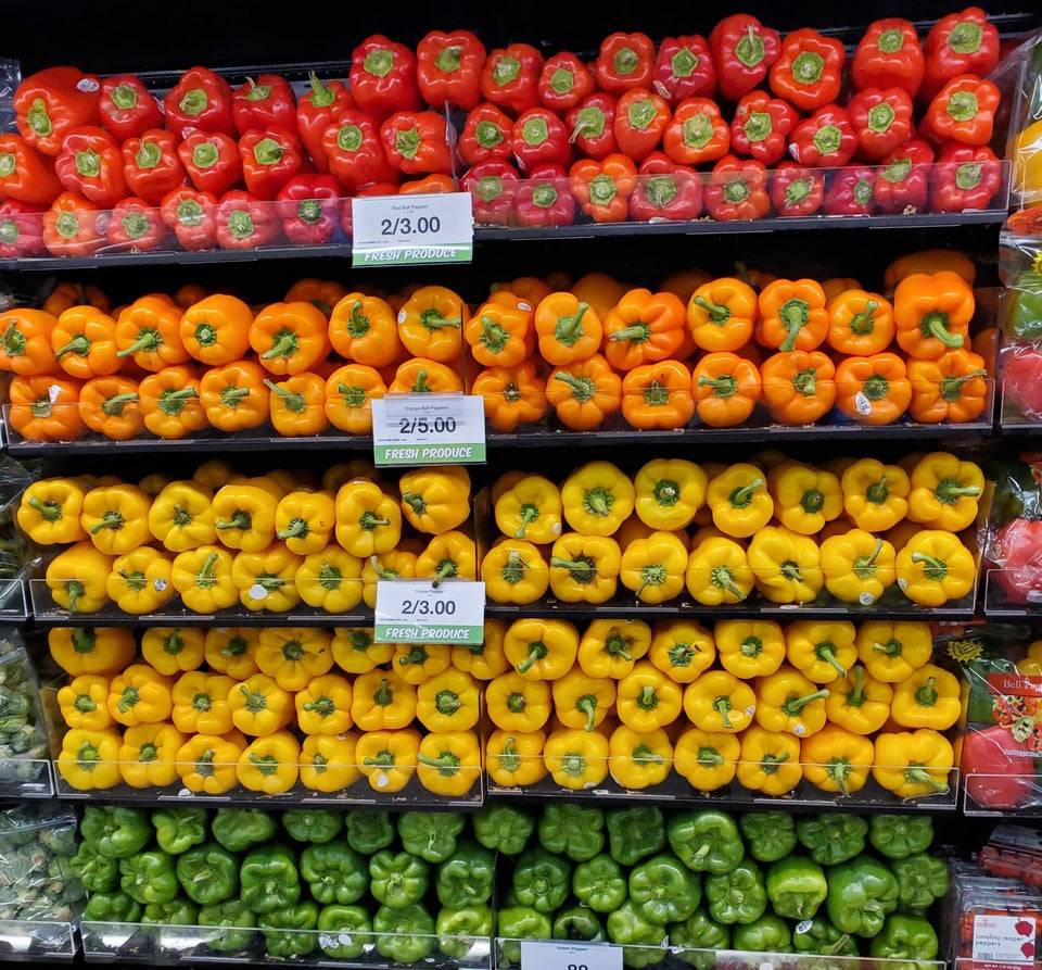 perfectly arranged bell peppers in grocery store