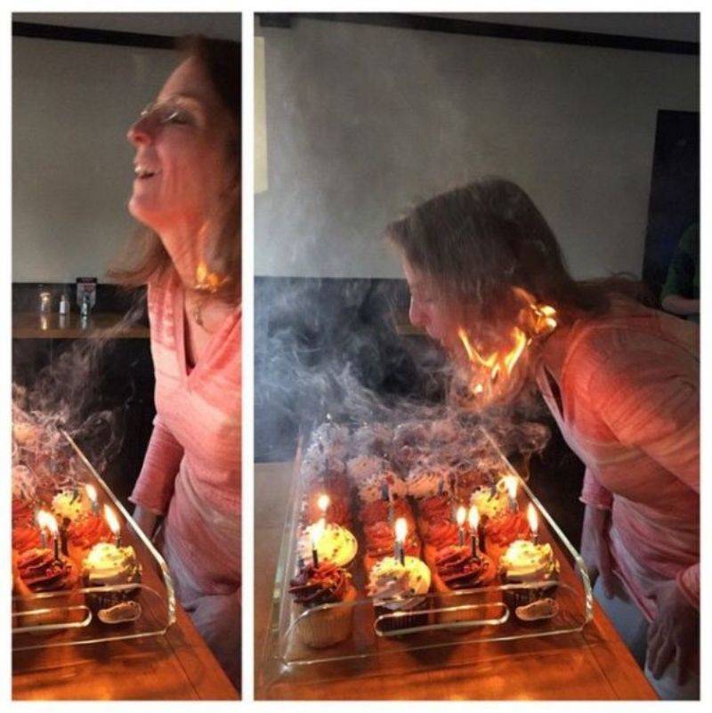 someone blowing out candles and lighting their hair on fire 