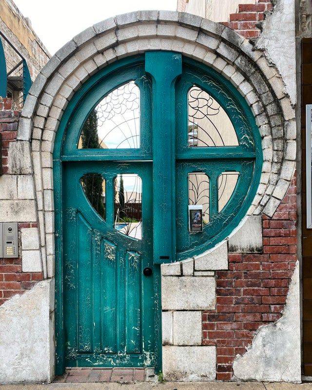 door that blends into large circular window frame