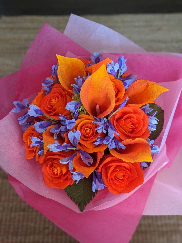beautiful orange and blue crepe bouquet of flowers