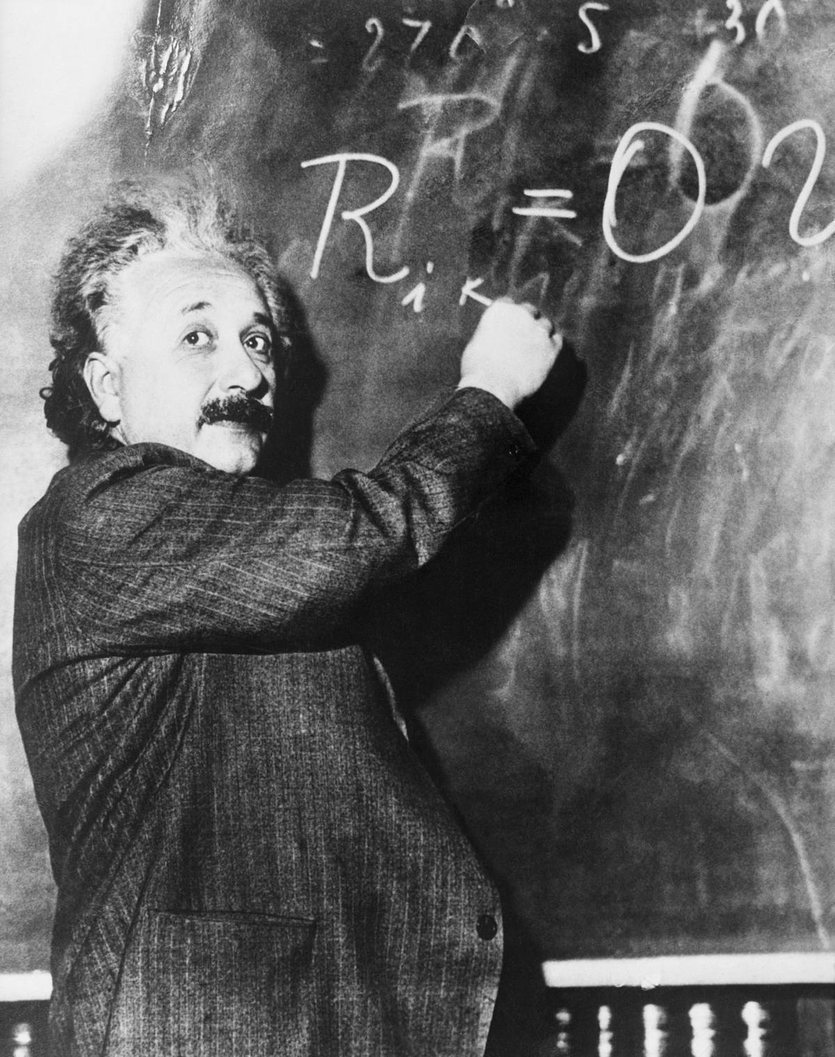 Einstein Writing Equation on Blackboard