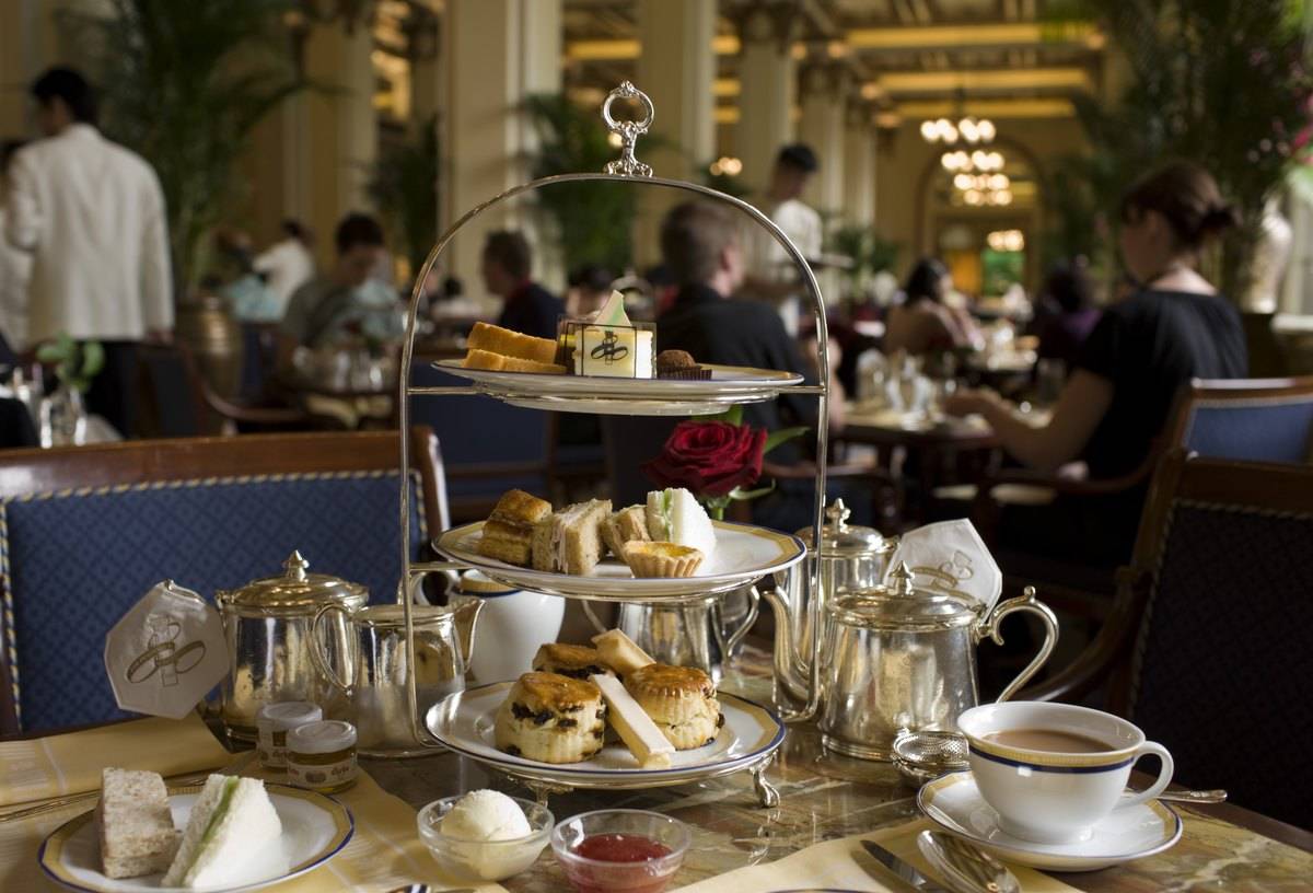 A high tea three-tier tray holds food at the Peninsula Hotel.