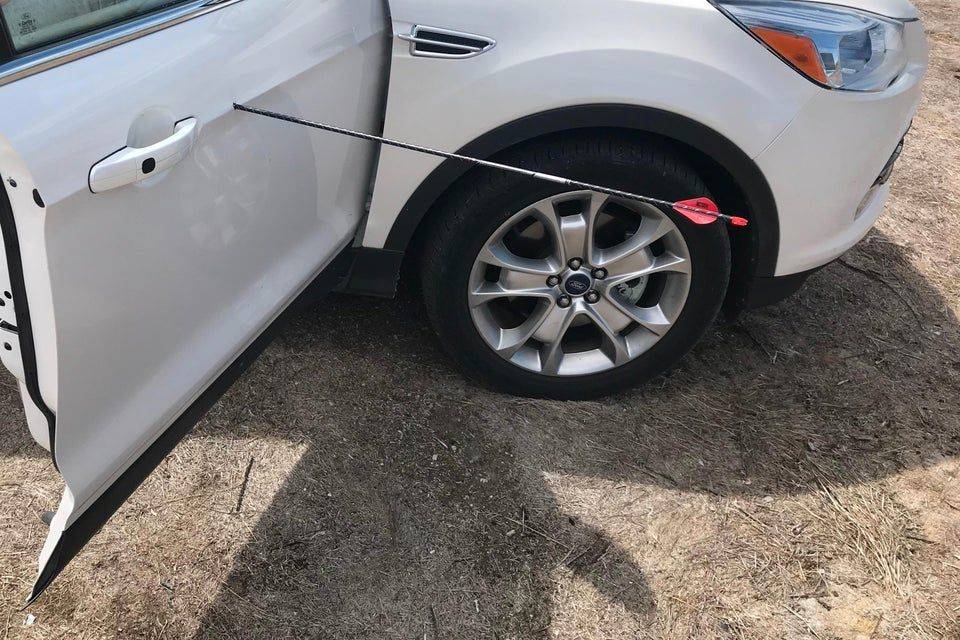 arrow in side of car