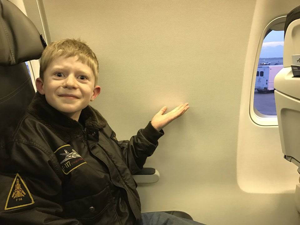 kid pointing to lack of window with a grimace