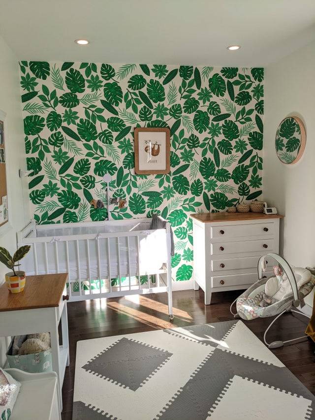 hand painted leaf mural in baby's nursery