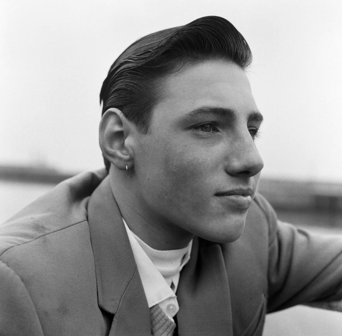 Ray Winney, 16, shows off his earring. 'Dockside Dandies' at Lowestoft, Suffolk, 16th May 1962