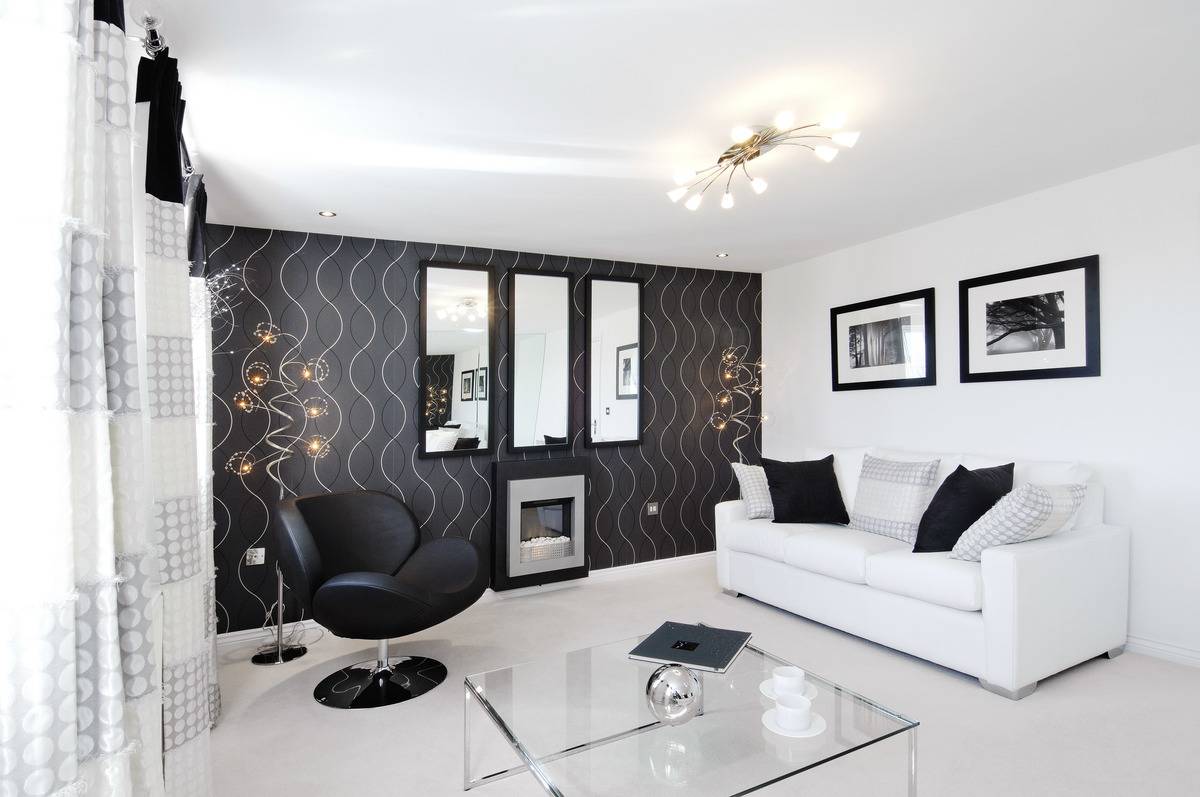 A luxury lounge features modern, black-and-white furniture and decor.