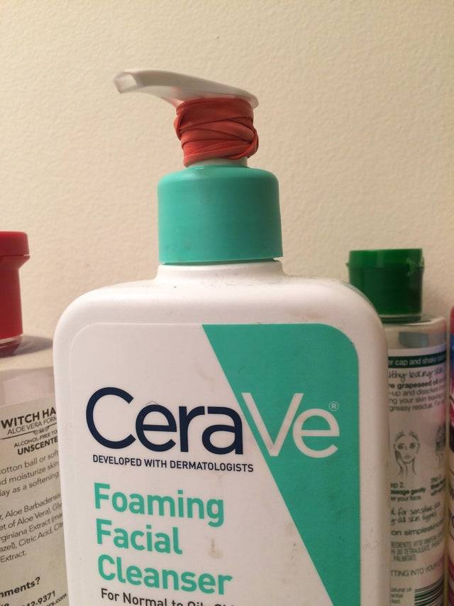 elastic band around top of lotion bottle 