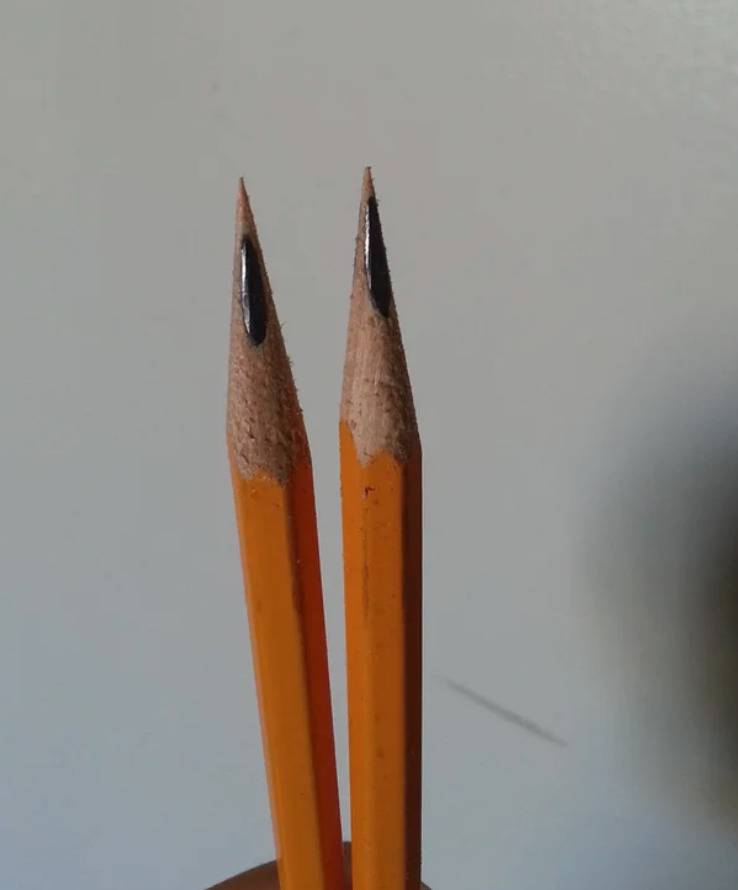 pencils are sharpened but lead is off center so wood is at the point