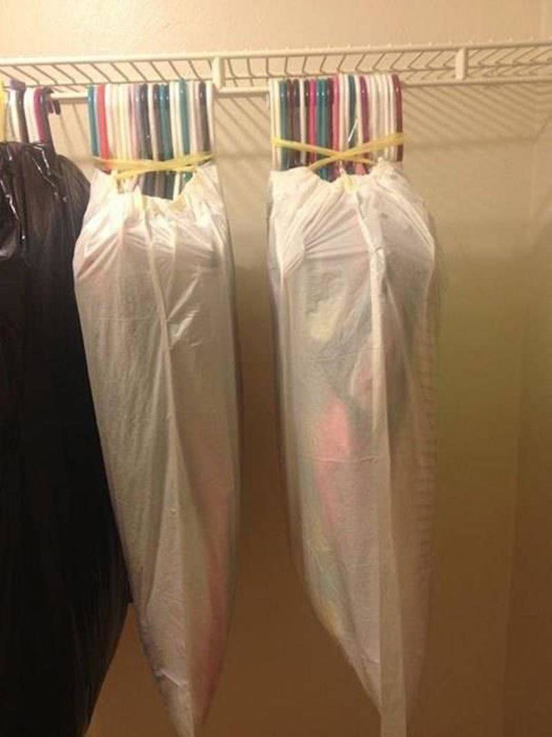 clothes on hangers in bags