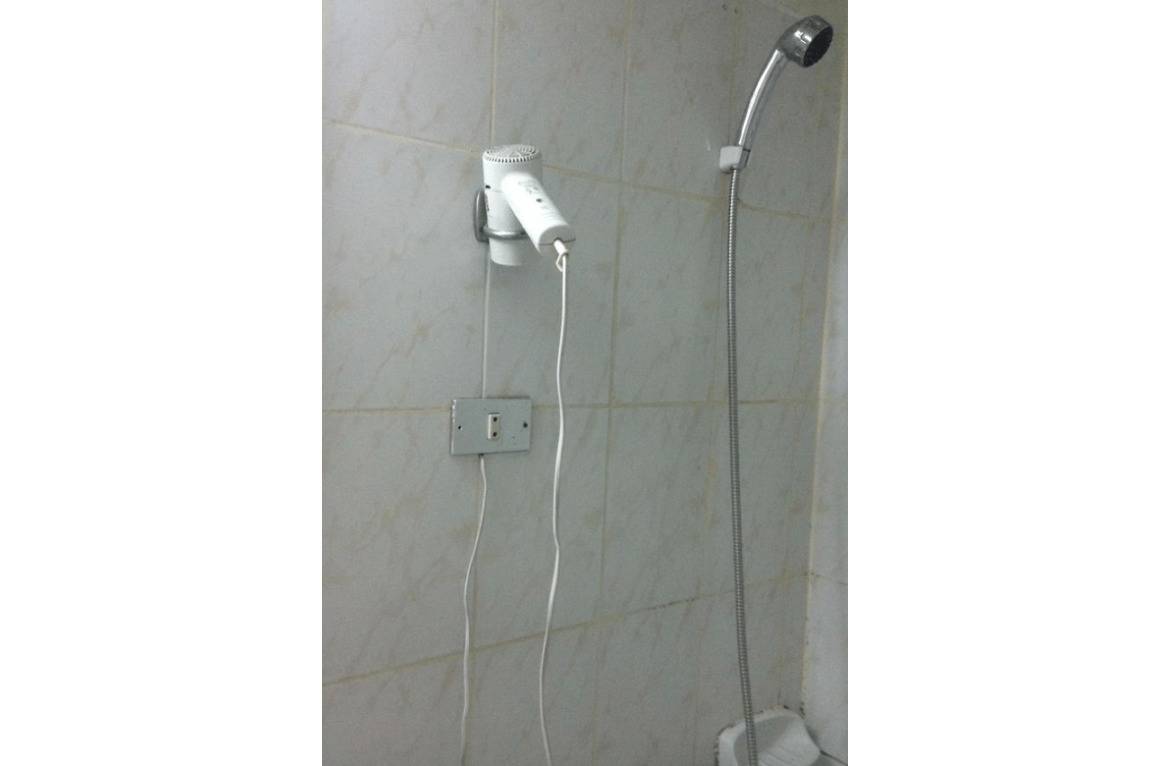 blowdryer is placed in hotel shower