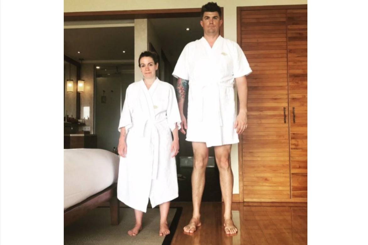 hotel bathrobe is too small for tall man