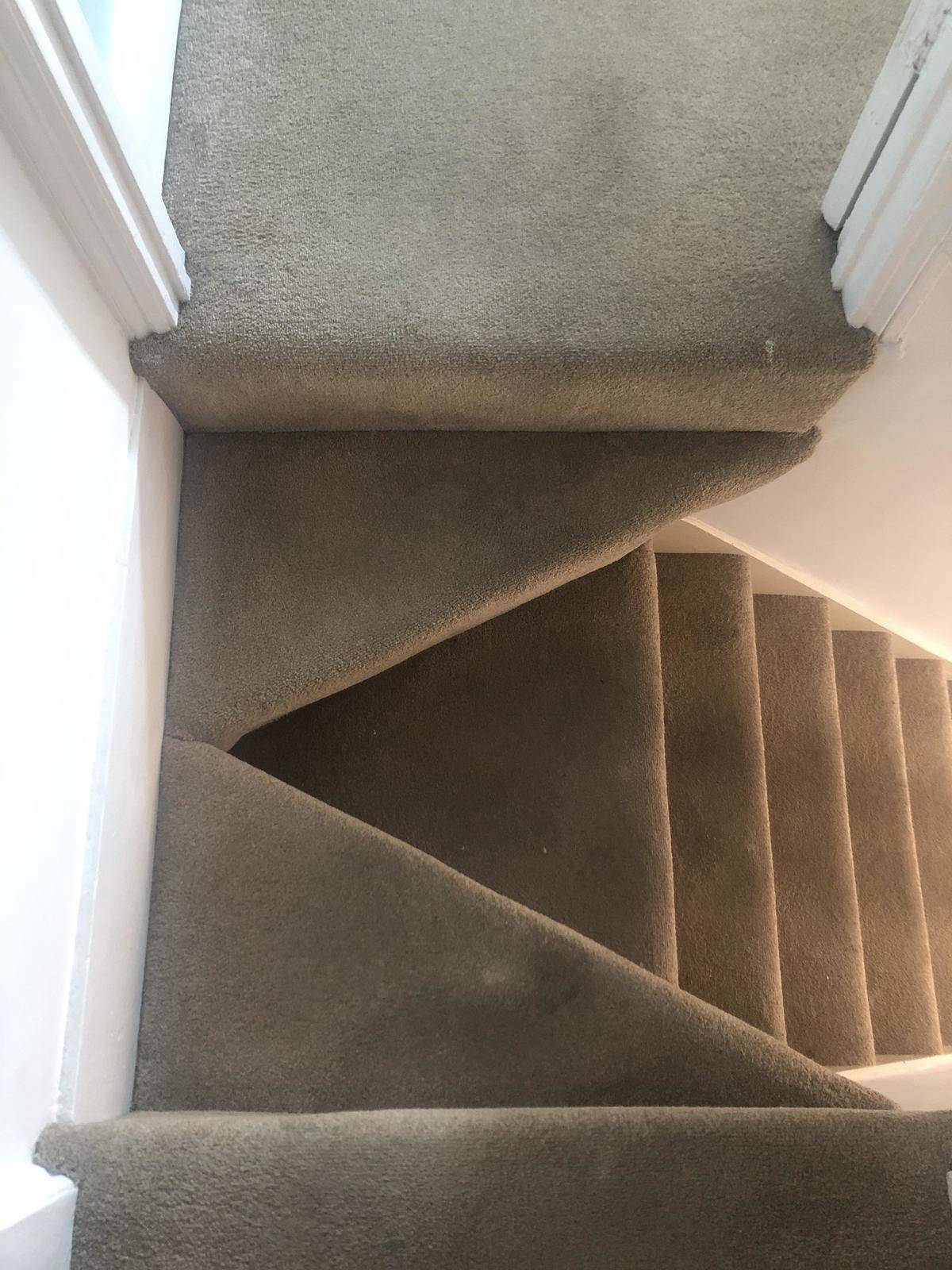 staircase made out of carpet and with a hole