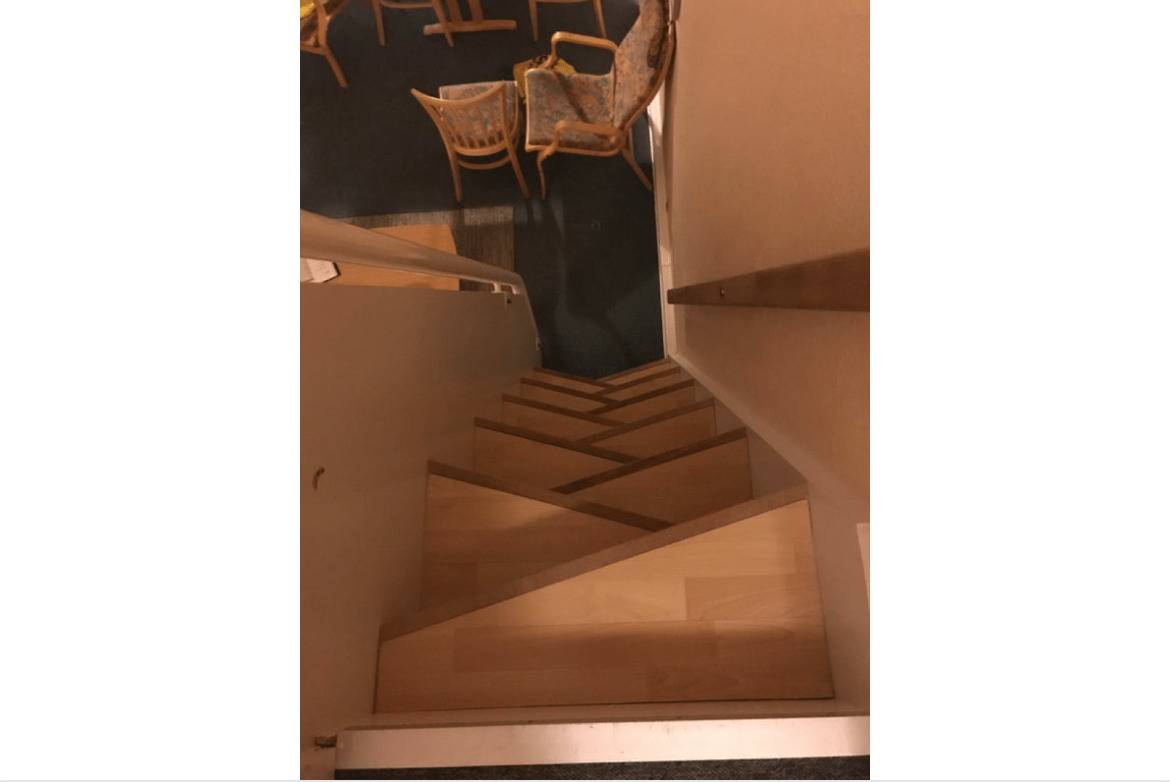 staircase in hotel has steep and short steps