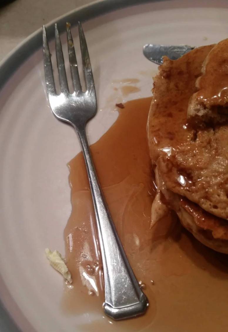 fork with handle resting in maple syrup