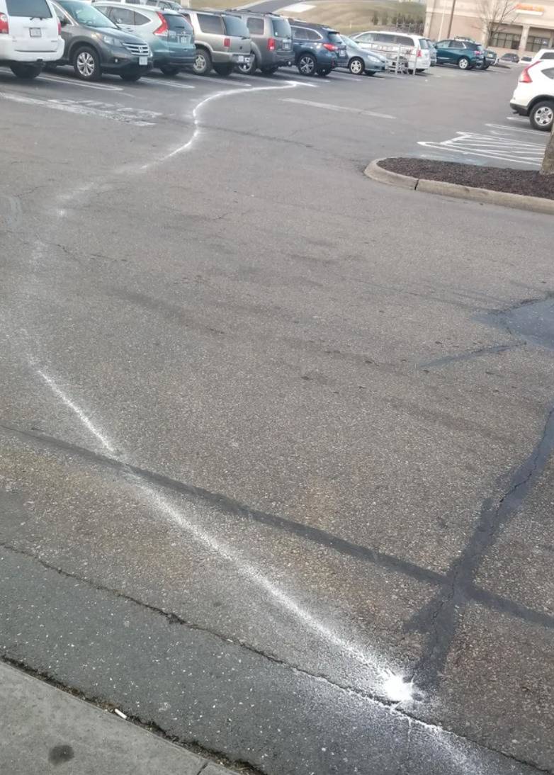 squiggly white line on parking lot ground
