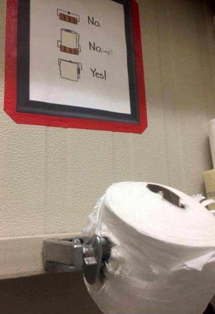 toilet paper impaled on toilet paper holder