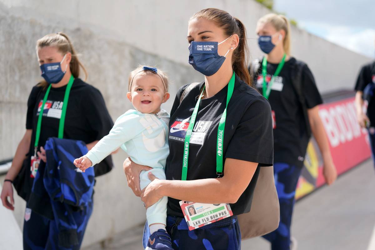 Alex Morgan #13 of the United States with her new baby girl arrives at the stadium before a game between Brazil and USWN