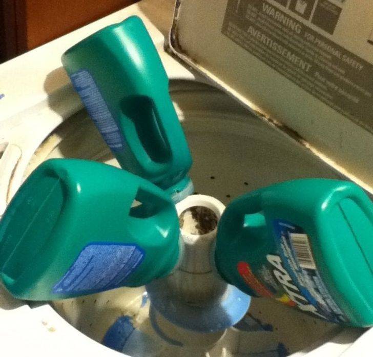 detergent bottles pouring into washing machine
