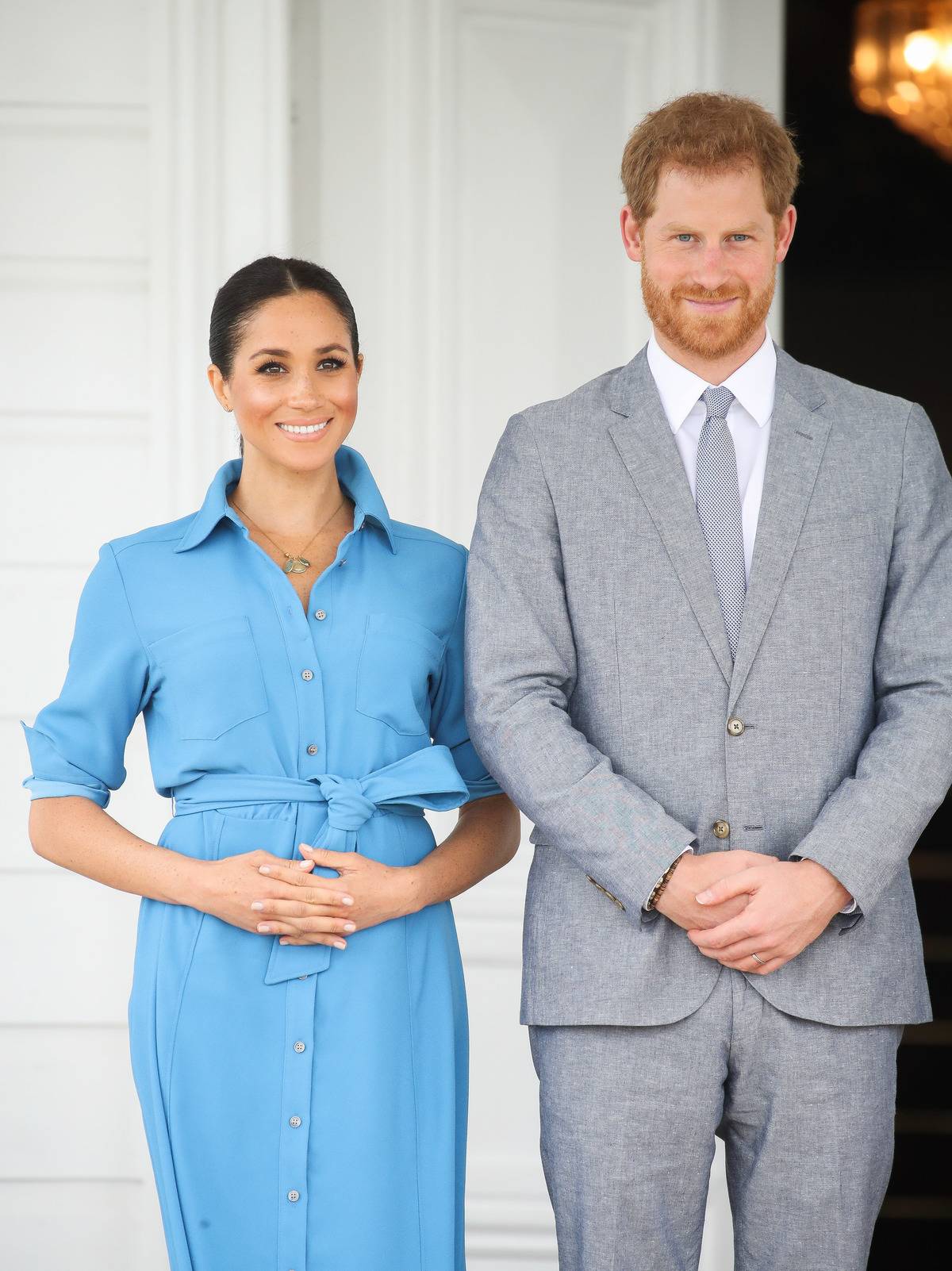 Prince Harry and Duchess Meghan stand with King Tupou VI and Queen NanasipauÔu TukuÔaho of Tonga.