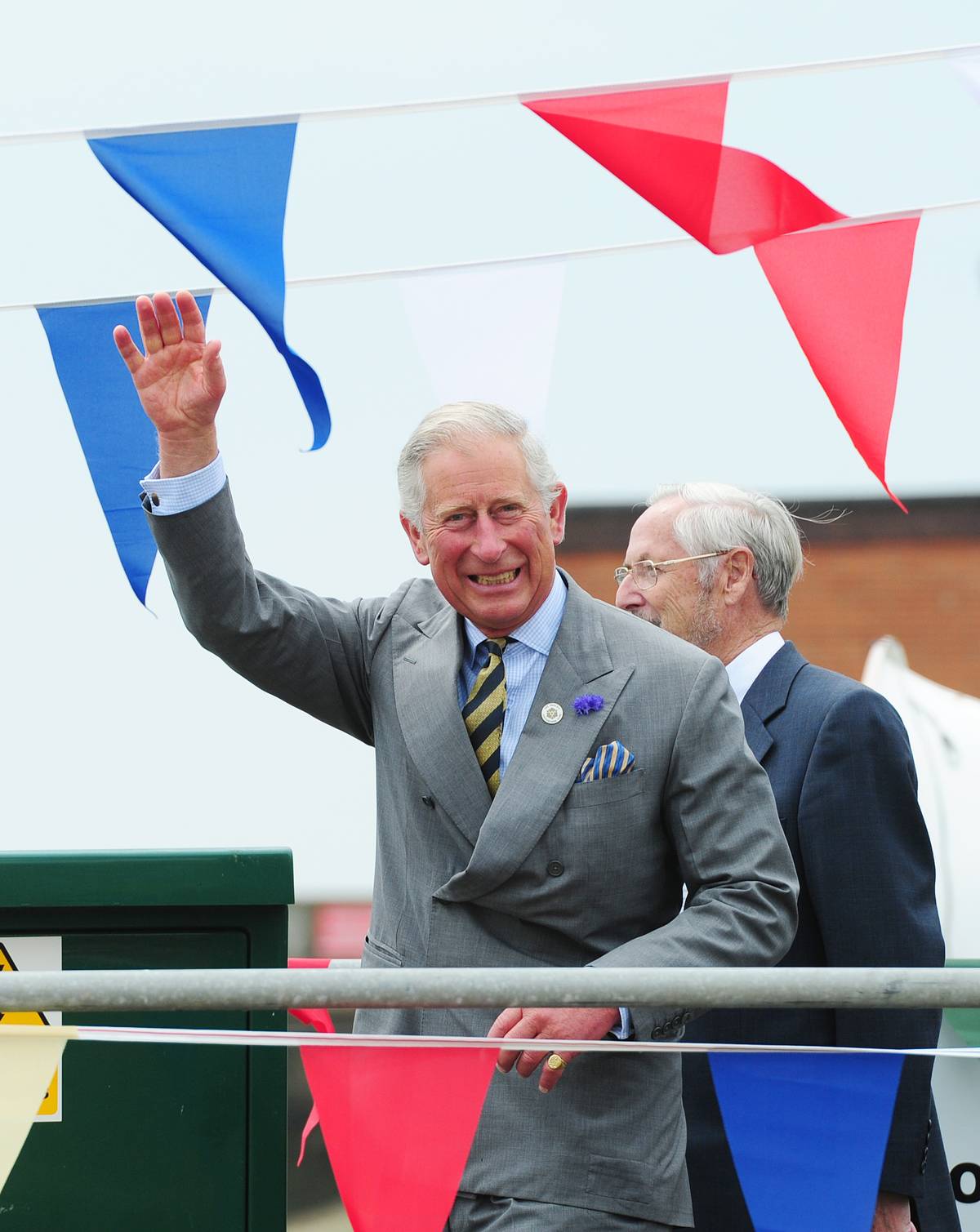 Charles, Prince of Wales waves to the crowds at Bridlington Harbour.