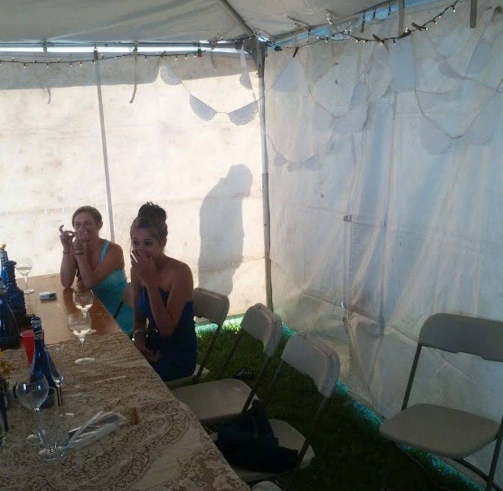 shadow of guy peeing outside of tent