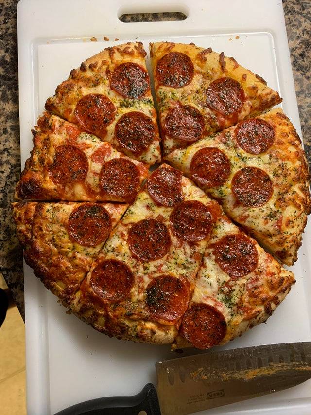 boyfriend cuts pizza in weird shapes to avoid cutting pepperoni pieces
