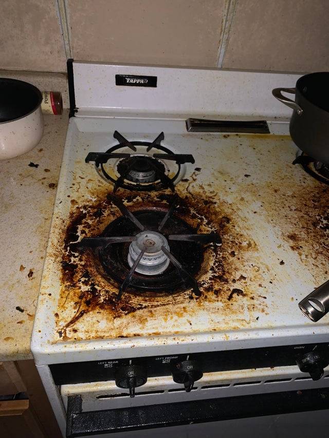 stove burner with baked on food and dirt