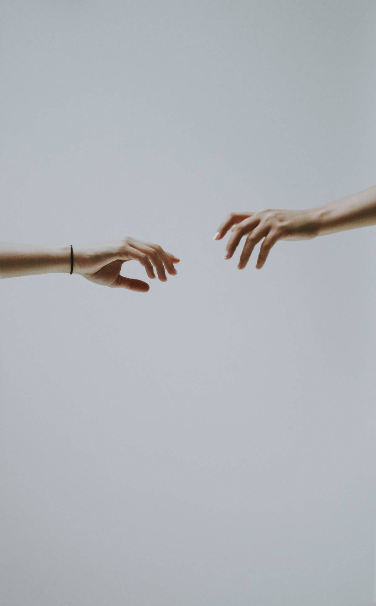 hands letting go of each other closeup
