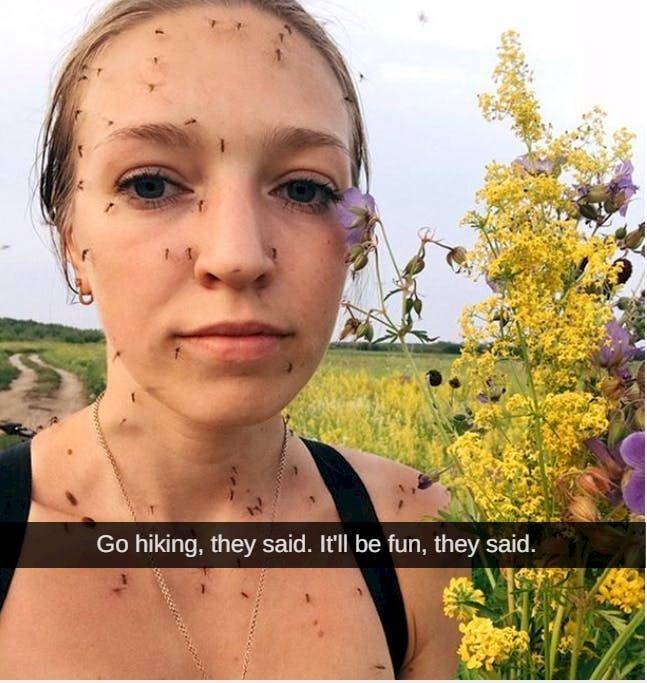 girl with lots of small bugs all over her face and chest 