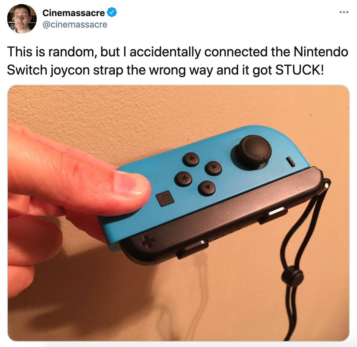 Tweet: This is random, but I accidentally connected the Nintendo Switch joycon strap the wrong way and it got STUCK!