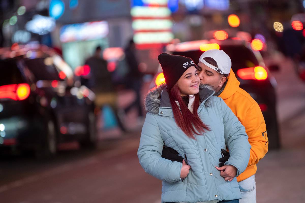 : A couple poses together kissing on Valentine's Day in Times Square on February 14, 2021 in New York City.